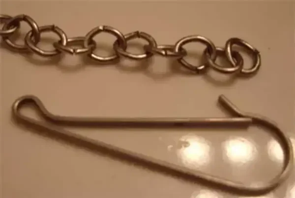 Remove the toilet flapper clip from chain