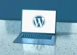 Laptop displaying the WordPress logo for a website upgrade tutorial