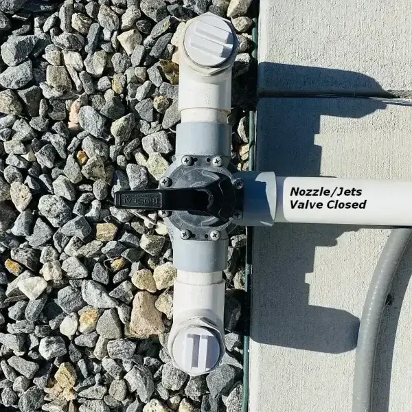 Nozzle valve shown closed, blocking the lines feeding the nozzles. closed nozzle valve
